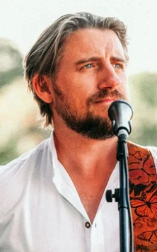 Ryan Inglis singing at an outdoor wedding